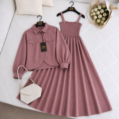 Pink outfit with matching jacket and dress, white handbag, and flowers on a light background