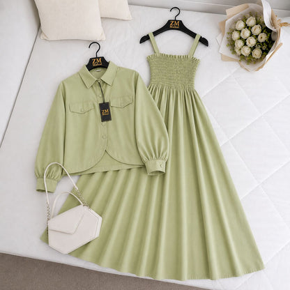 Green outfit with shirt, dress, and handbag on a white surface with 'ZM' branding.