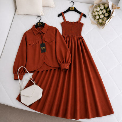Brown dress, blouse, and white handbag on a white surface with 'ZM' branding.
