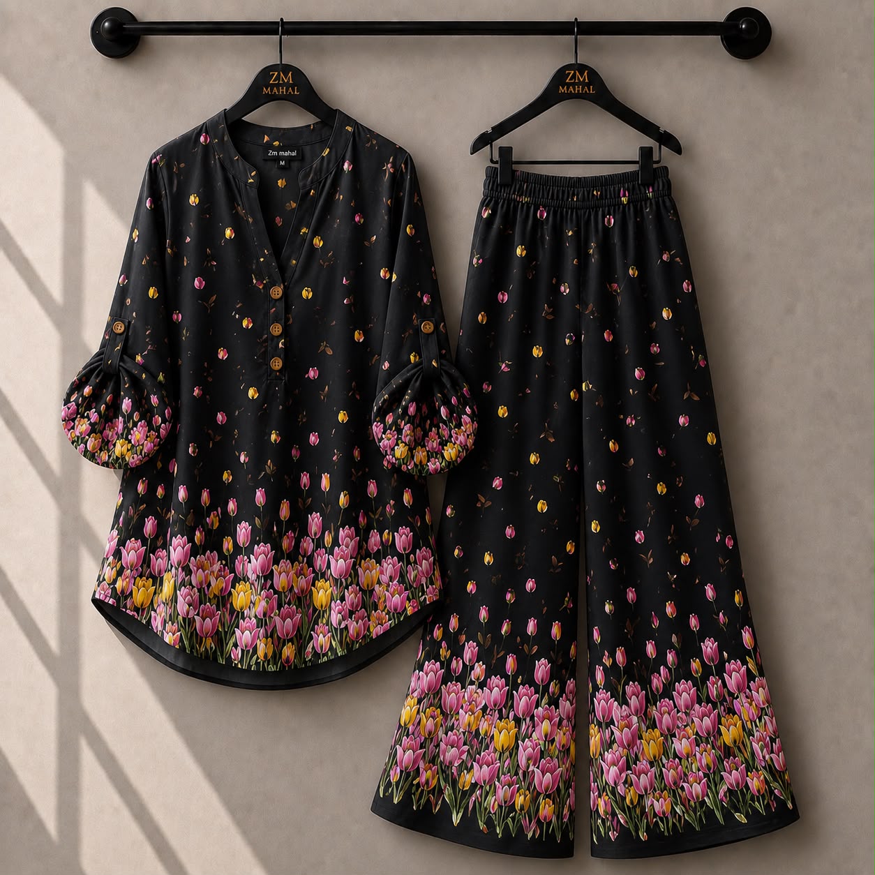 Black tulip print co-ord set featuring colorful floral shirt and matching trousers.