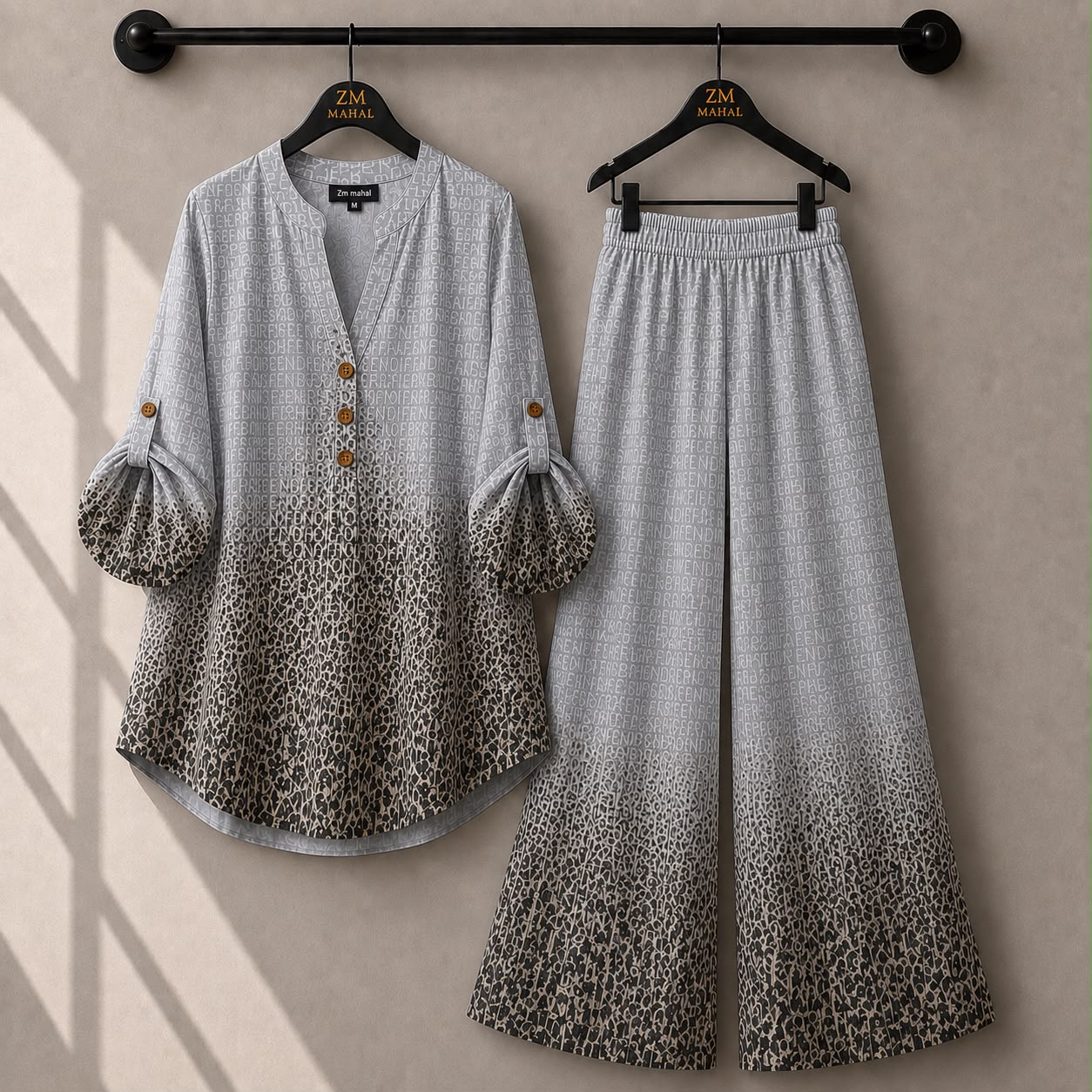 Grey leopard print women's co-ord set with roll-up sleeve shirt and matching wide-leg trousers.